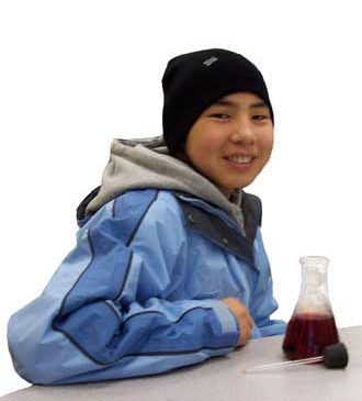 Photo: ACMP student with a beaker used to make a thermometer